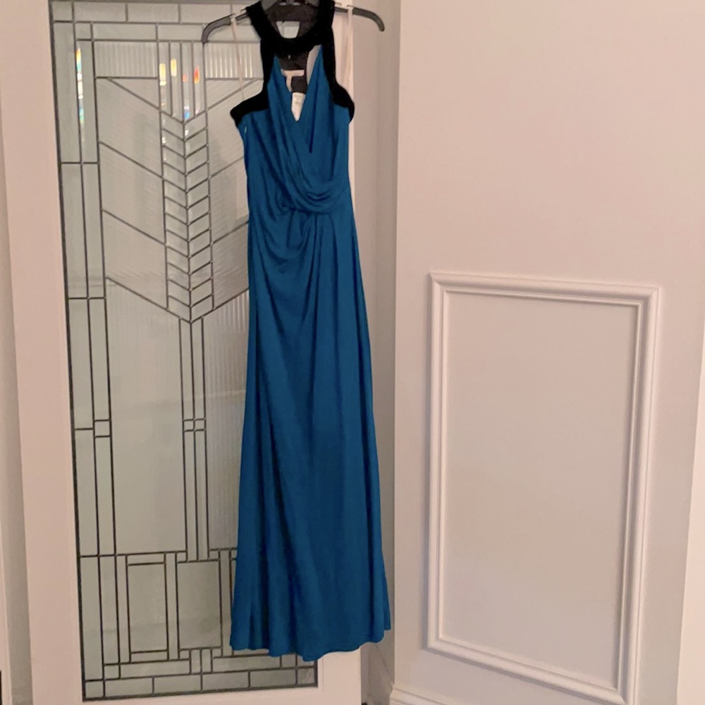 Floor length slate blue stretchy gown, black velvet collar, wrap front